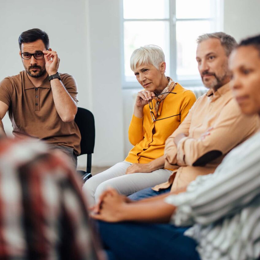 group of adults sitting